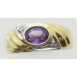 American 14ct gold ladies oval amethyst and diamond ring, size M, 3.7g. P&P Group 1 (£14+VAT for the