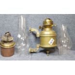 Wall mounted brass parrafin lamp, further inner for the same, and two glass chimneys. P&P Group