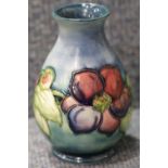 Moorcroft Bulbous vase in the Blue Anemone pattern, H: 11 cm. P&P Group 1 (£14+VAT for the first lot