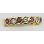 Ladies 18ct gold, ruby and diamond rubover set ring, size N, 3.0g. P&P Group 1 (£14+VAT for the