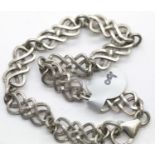 Silver solid link Celtic design bracelet. P&P Group 1 (£14+VAT for the first lot and £1+VAT for