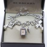 Ladies Burberry silver charm bracelet with 12 assorted charms, 1 watch charm, RRP £500.00. P&P Group