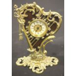 Mechanical clock in the form of a brass harp, H: 23 cm. P&P Group 2 (£18+VAT for the first lot