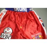 Frank Bruno signed red boxing shorts with no CoA. P&P Group 2 (£18+VAT for the first lot and £2+
