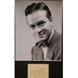 Bob Hope, framed signature with publicity shot photograph, 24 x 19 cm, with no CoA. P&P Group 2 (£