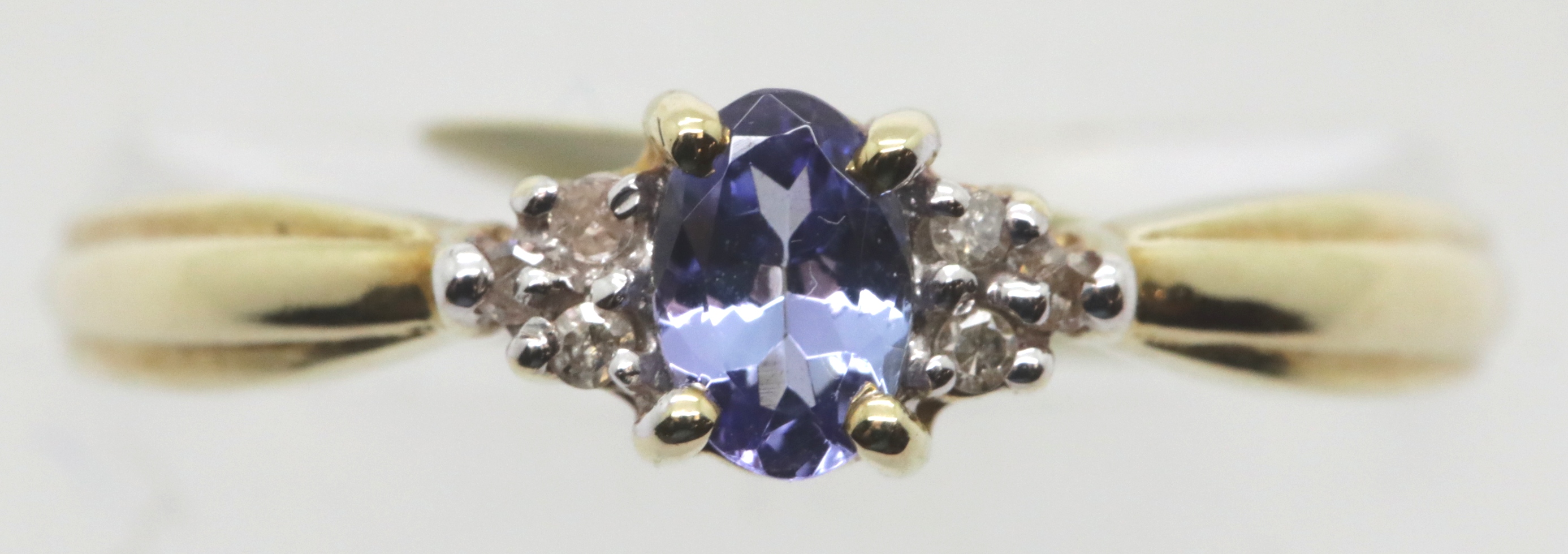 Ladies tanzanite and diamond fancy ring, size R, 2.0g. P&P Group 1 (£14+VAT for the first lot and £