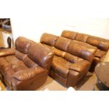 Two brown leather three seater settees and one brown leather two seater settee. This lot is not