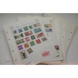 Collection of loose stamp album pages with postage stamps. P&P Group 1 (£14+VAT for the first lot