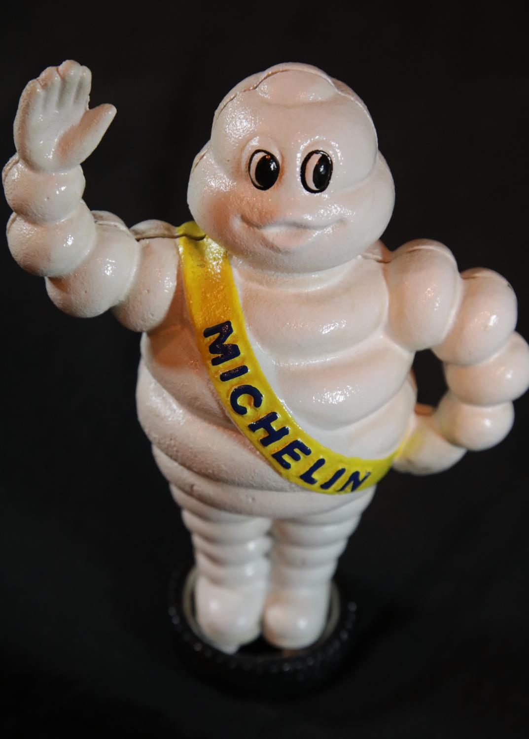 Cast iron Michelin man waving on tyre moneybox, H: 22 cm. P&P Group 2 (£18+VAT for the first lot and