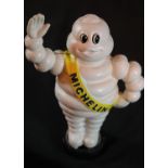 Cast iron Michelin man waving on tyre moneybox, H: 22 cm. P&P Group 2 (£18+VAT for the first lot and