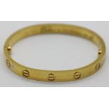 Gold plated Cartier style bangle, D: 63 mm. P&P Group 1 (£14+VAT for the first lot and £1+VAT for