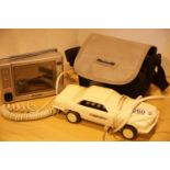 Betacom novelty telephone and a cased portable Roadstar colour TV. P&P Group 2 (£18+VAT for the