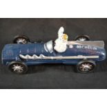 Cast iron Michelin man racing car in blue, L: 27 cm. P&P Group 2 (£18+VAT for the first lot and £2+