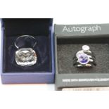 Boxed Swarovski crystal solitaire ring with papers and three autograph rings with Swarovski