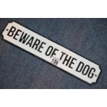 SOLD FOR THE NHS Cast iron Beware of the Dog sign wall plaque, 36 x 8 cm. P&P Group 2 (£18+VAT for