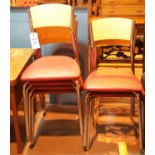 Set of six chromium framed stacking chairs with red leatherette seats and wooden backs. This lot