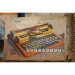 Boxed Mettoy toy minor typewriter. P&P Group 1 (£14+VAT for the first lot and £1+VAT for