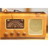 Walnut cased vintage The Barker radio with Bakelite knobs. This lot is not available for in-house