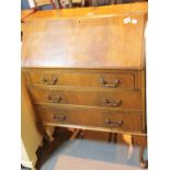 Veneered writing bureau with drop front and three drawers (key in office - 8700). This lot is not