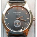 New Boxed Anthony James black faced gents wristwatch with gold hands on a leather strap. P&P Group 1