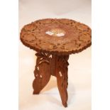 Heavily carved Anglo indian side table, H: 50 cm. P&P Group 2 (£18+VAT for the first lot and £2+