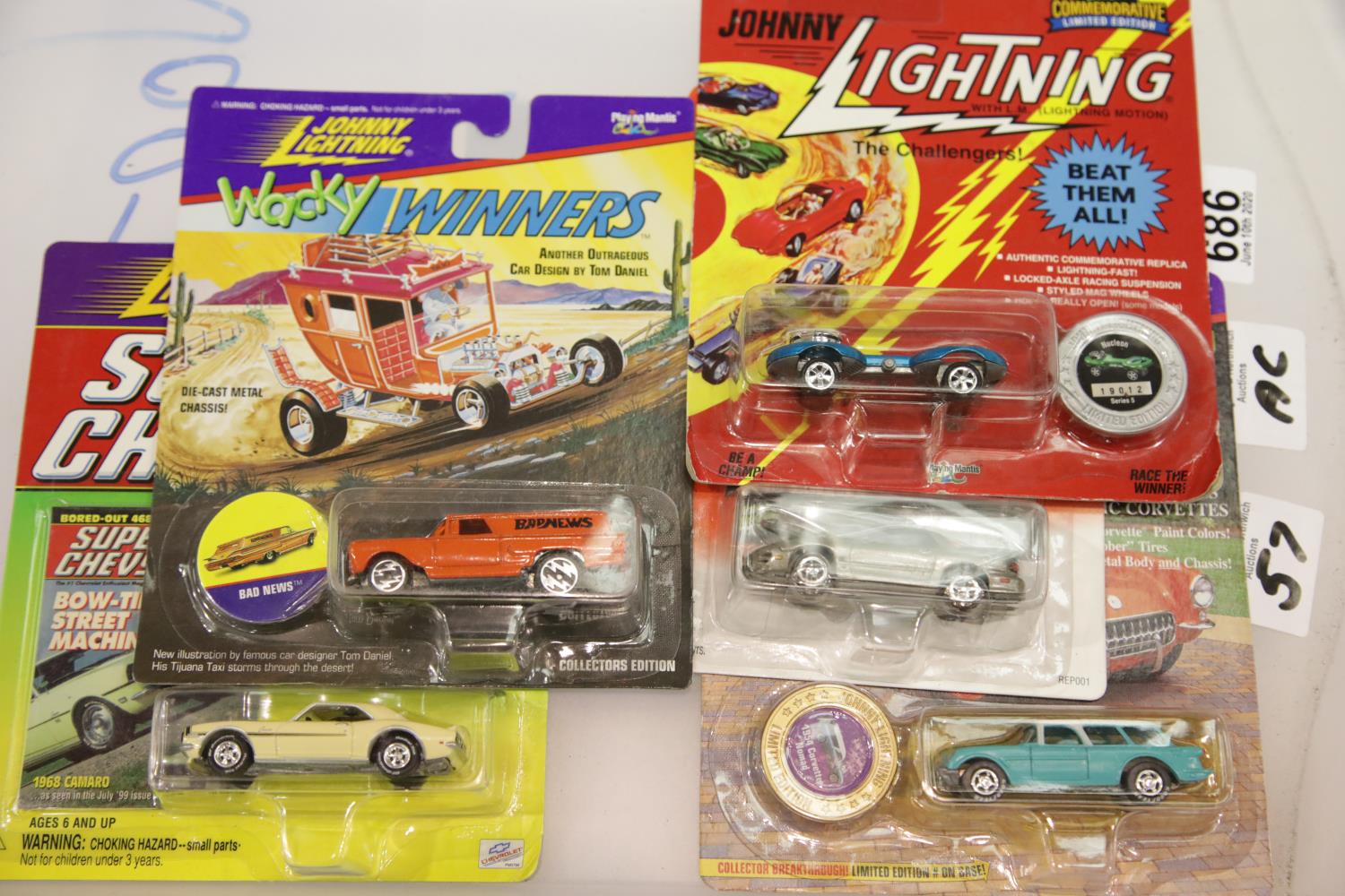 Five Johnny Lightning diecast vehicles: Modern Muscle Firebird, Challengers Nucleon, Classic Customs