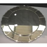 Large flower shaped bevelled edge mirror with twelve petal panels, D: 70 cm. This lot is not