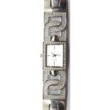 Ladies DKNY stone set fancy ladies wristwatch. P&P Group 1 (£14+VAT for the first lot and £1+VAT for