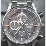 Seiko black faced multi dial chronograph wristwatch on a steel strap with box and papers. RRP £279.