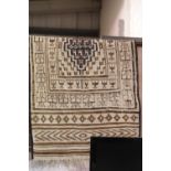 Vintage Peruvian hand knitted floor rug, L: 2.25m, W: 1.07m. P&P Group 3 (£25+VAT for the first