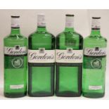 Four bottles of Gordons Dry gin 2 x ltr and 2 x 70cl. P&P Group 3 (£25+VAT for the first lot and £