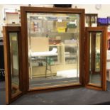 Large bi-fold walnut cased bevelled edge mirror, H: 67 cm. This lot is not available for in-house