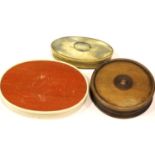 A 19thC oval horn snuff or tobacco box, L: 85 mm, a large oval ivory bound box, L: 115 mm, and a