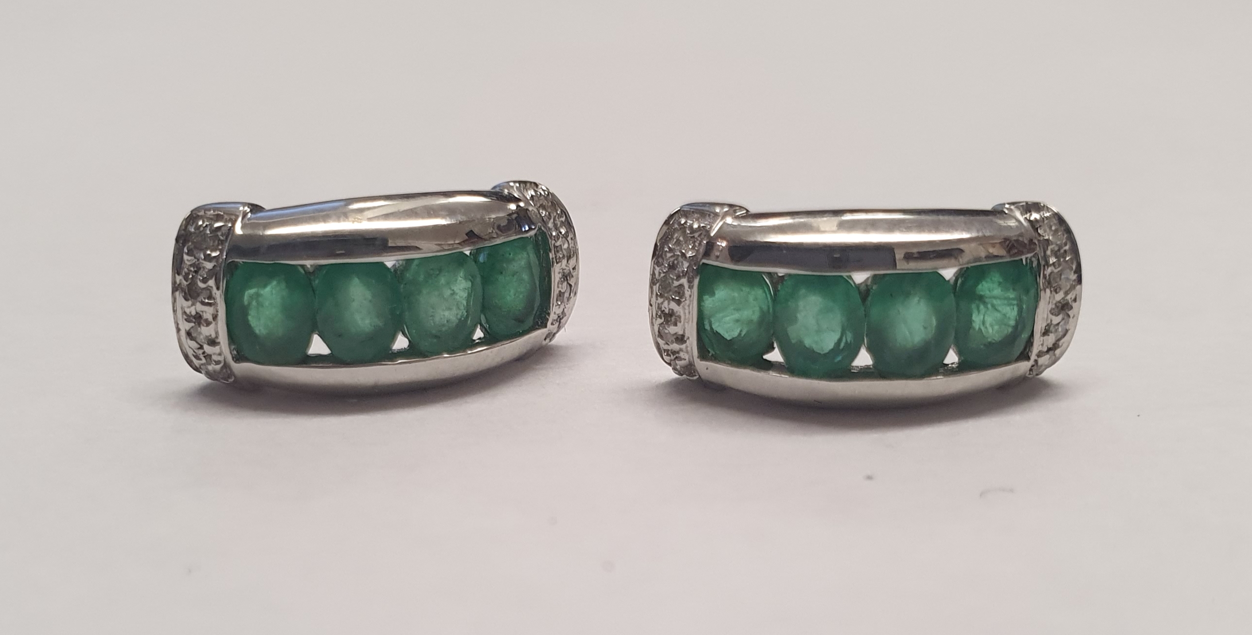 Pair of contemporary 9ct white gold, emerald and diamond earrings. P&P Group 1 (£14+VAT for the