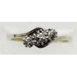 Antique 18ct gold and platinum three stone on a twist diamond ring, size K, 2.4g. P&P Group 1 (£14+