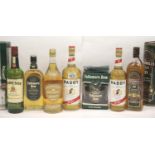 Seven mixed bottles of Irish whiskey: Bushmills, Paddy, Tullamore dew, John Power and Jameson. All