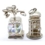 Two 1970s solid silver charms, one in the style of a telephone box, 12.5g. P&P Group 1 (£14+VAT