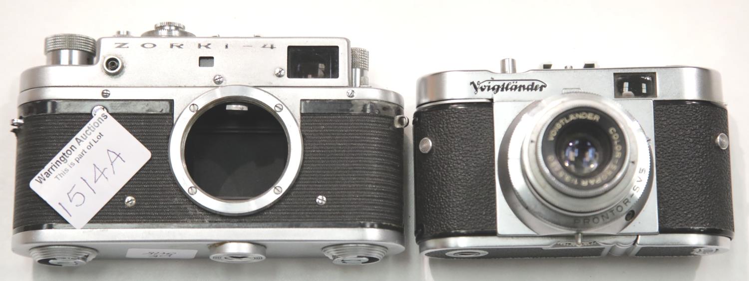 Vintage German Voigtlander film camera color skopar 1:3.5/50 and a Russian Zorki 4 film camera body.