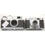 Vintage German Voigtlander film camera color skopar 1:3.5/50 and a Russian Zorki 4 film camera body.