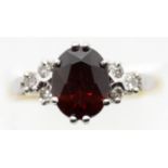 Ladies 18ct gold, fancy garnet and diamond ring, size O, 4.0g. P&P Group 1 (£14+VAT for the first