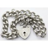 Vintage 1970s silver charm bracelet with padlock and safety chain, L: 16 cm, 20g. P&P Group 1 (£14+
