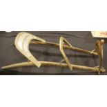 Antique Far Eastern brass and double camel saddle. This lot is not available for in-house P&P,