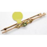 Antique 9ct rose gold peridot set fancy brooch, L: 55 mm, 2.4g. P&P Group 1 (£14+VAT for the first