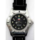 Unisex Tag Heuer wristwatch with quartz movement and black dial, case D: 33mm. P&P Group 1 (£14+