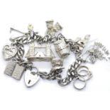Silver charm bracelet with padlock clasp containing ten charms, 60g. P&P Group 1 (£14+VAT for the