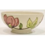 Moorcroft footed bowl in the Pink Magnolia pattern, D: 16 cm. P&P Group 1 (£14+VAT for the first lot