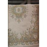 Cream and green ground floral rug with fringe, L: 1.8 m , W: 0.9 m. This lot is not available for