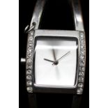 Karen Millen ladies silver plated bangle watch, boxed with papers. Requires battery, signs of loss