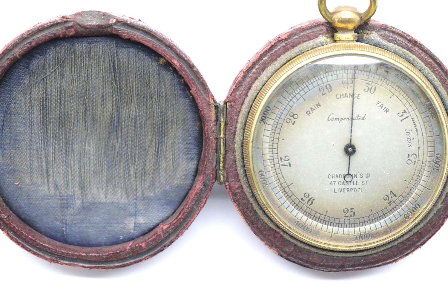 Chadburn's, Liverpool: a gilt brass cased compensated pocket barometer, D: 45 mm, with its