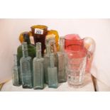 Nine green glass bottles and other glass items. This lot is not available for in-house P&P, please